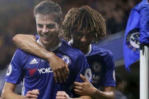 Chelsea's Cesar Azpilicueta, left, celebrates scoring a goal with Nathan Ake during the English Premier League soccer match between Chelsea and Watford at Stamford Bridge stadium in London, Monday, May 15, 2017. (AP Photo/Tim Ireland)