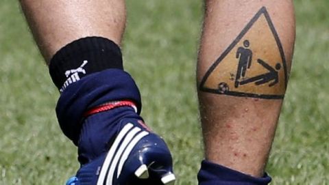 Italy defender Daniele De Rossi sports a tattoo on his leg during a training session at the Euro 2012 soccer championship in Krakow, Poland, Friday, June 8, 2012. (AP Photo/Gregorio Borgia)