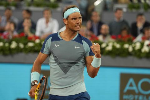 Rafael Nadal of Spain celebrates after a winning point against Miomir Kecmanovic of Serbia during their match at the Mutua Madrid Open tennis tournament in Madrid, Spain, Wednesday, May 4, 2022. (AP Photo/Paul White)