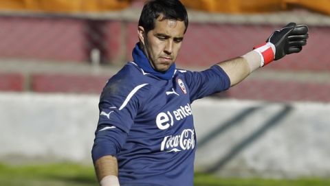 FILE - In this Saturday July 16, 2011 file photo, Real Sociedad goalkeeper Claudio Bravo of Chile plays the ball during a Copa America quarterfinal training session in Mendoza, Argentina. (AP Photo/Jorge Saenz, File)