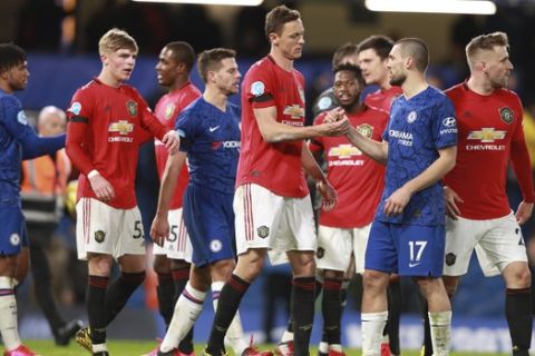 Players shake hands after the English Premier League soccer match between Chelsea and Manchester United at Stamford Bridge in London, England, Monday, Feb. 17, 2020. (AP Photo/Ian Walton)