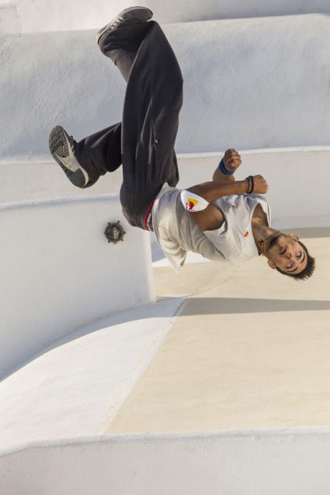 Dimitris Kyrsanidis of Athens performs during the finals at the "Red Bull Art of Motion" freerunning competition on Santorini Island, Greece on October 3, 2015
