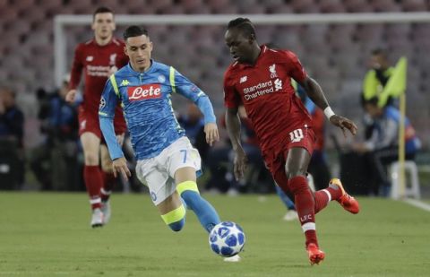 Napoli forward Jose Callejon, left, and Liverpool midfielder Sadio Mane go for the ball during the Champions League, group C soccer match between Napoli and Liverpool, at the San Paolo Stadium in Naples, Italy, Wednesday, Oct. 3, 2018. (AP Photo/Andrew Medichini)