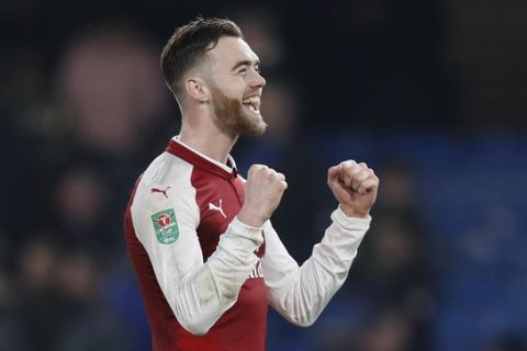 Arsenal's Calum Chambers celebrates after the English League Cup semifinal first leg soccer match between Chelsea and Arsenal at Stamford Bridge stadium in London, Wednesday, Jan. 10, 2018. (AP Photo/Kirsty Wigglesworth)