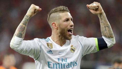Real Madrid's Sergio Ramos celebrates after winning the Champions League Final soccer match between Real Madrid and Liverpool at the Olimpiyskiy Stadium in Kiev, Ukraine, Saturday, May 26, 2018. (AP Photo/Sergei Grits)