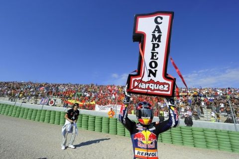 Red Bull Ajo Motorsport Team's Spanish rider Marc Marquez celebrates after winning the World Champion title after the Moto 125 race of the Valencia Grand Prix at Ricardo Tormo racetrack in Cheste, on November 7, 2010.  AFP PHOTO / JOSE JORDAN (Photo credit should read JOSE JORDAN/AFP/Getty Images)