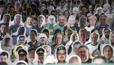 Cardboard pictures of fans ahead the German first division Bundesliga football match Borussia Moenchengladbach and Bayer 04 Leverkusen on Saturday, May 23, 2020 in Moenchengladbach, western Germany. (Ina Fassbender/pool via AP)