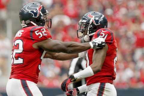 HOUSTON, TX- OCTOBER 21: Tim Dobbins #52 of the Houston Texans celebrates with Brice McCain #21 of the Houston Texans after breaking up a pass to Anquan Boldin #81 of the Baltimore Ravens on October 21, 2012 at Reliant Stadium in Houston, Texas. Texas won 43 to 13. (Photo by Thomas B. Shea/Getty Images)