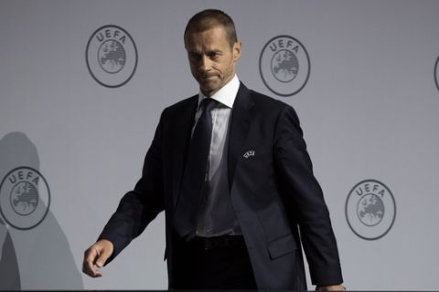 UEFA President Aleksander Ceferin arrives for a press conference following a meeting of European soccer leaders at the congress of the UEFA governing body in Amsterdam's Beurs van Berlage, Netherlands, Tuesday, March 3, 2020. (AP Photo/Peter Dejong)