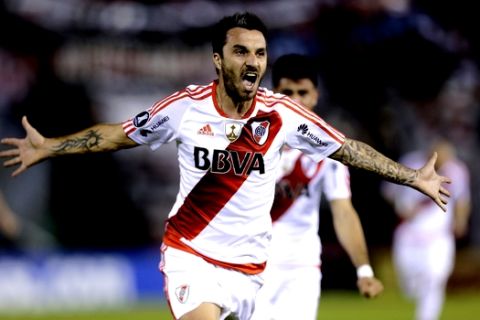 Striker Ignacio Scocco of Argentina's River Plate celebrates after scoring during a Copa Libertadores soccer game against Paraguay's Guarani in Asuncion, Paraguay, Tuesday, July 4, 2017. (AP Photo/Jorge Saenz)
