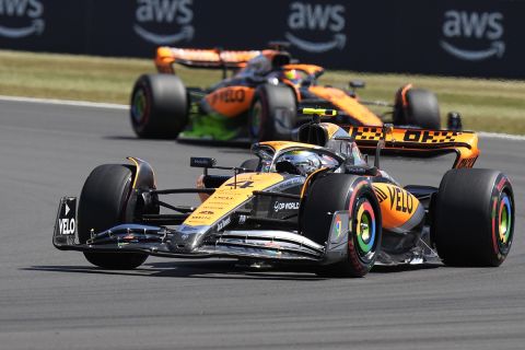 McLaren driver Lando Norris, bottom, of Britain, steers his car followed by his teammate McLaren driver Oscar Piastri, of Australia, during the first free practice at the British Formula One Grand Prix at the Silverstone racetrack, Silverstone, England, Friday, July 7, 2023. The British Formula One Grand Prix will be held on Sunday.(AP Photo/Luca Bruno)