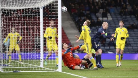 Scotland's Steven Naismith, 2nd right, scores from a header, his side's second goal of the game against Kazakhstan during their UEFA Euro 2020 Qualifying soccer match at Hampden Park in Glasgow, Scotland, Tuesday Nov. 19, 2019. (Steve Welsh/PA via AP)