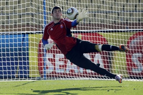 Slovakia World Cup soccer team goalkeeper Dusan Kuciak blocks a ball during a training session at Royal Bafokeng Stadium in Rustenburg, South Africa, Monday, June 14, 2010. Slovakia play in the group F of the World Cup Soccer. (AP Photo/ Lee Jin-man)