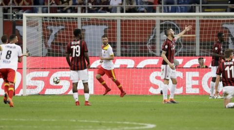 Benevento's Pietro Iemmello, center, celebrates after he scored during a Serie A soccer match between AC Milan and Benevento, at the San Siro stadium in Milan, Italy, Saturday, April 21, 2018. (AP Photo/Luca Bruno)