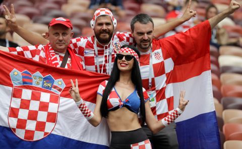 Croatia's fans pose for photographers before the final match between France and Croatia at the 2018 soccer World Cup in the Luzhniki Stadium in Moscow, Russia, Sunday, July 15, 2018. (AP Photo/Matthias Schrader)
