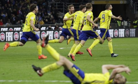 Swedish players react to their qualification at the end of the World Cup qualifying play-off second leg soccer match between Italy and Sweden, at the Milan San Siro stadium, Italy, Monday, Nov. 13, 2017. (AP Photo/Luca Bruno)