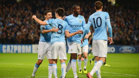 MANCHESTER, ENGLAND - NOVEMBER 27:  Samir Nasri of Manchester City celebrates scoring his team's second goal with Jesus Navas and Yaya Toure during the UEFA Champions League Group D match between Manchester City and FC Viktoria Plzen at Etihad Stadium on November 27, 2013 in Manchester, England.  (Photo by Michael Regan/Getty Images)