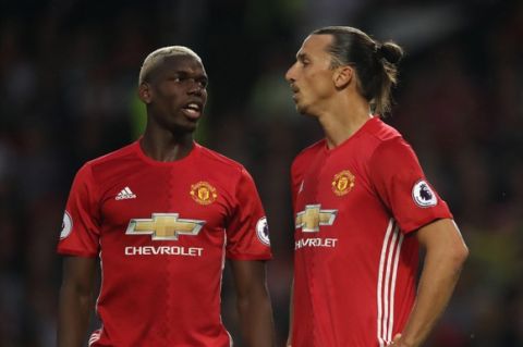 MANCHESTER, ENGLAND - AUGUST 19: Paul Pogba and Zlatan Ibrahimovic of Manchester United during the Premier League match between Manchester United and  Southampton at Old Trafford on August 19, 2016 in Manchester, England. (Photo by Matthew Ashton - AMA/Getty Images)