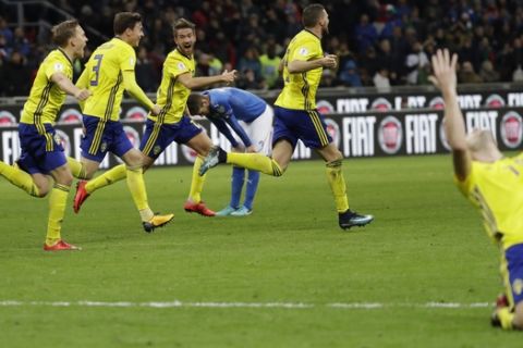 Swedish players react to their qualification at the end of the World Cup qualifying play-off second leg soccer match between Italy and Sweden, at the Milan San Siro stadium, Italy, Monday, Nov. 13, 2017. (AP Photo/Luca Bruno)