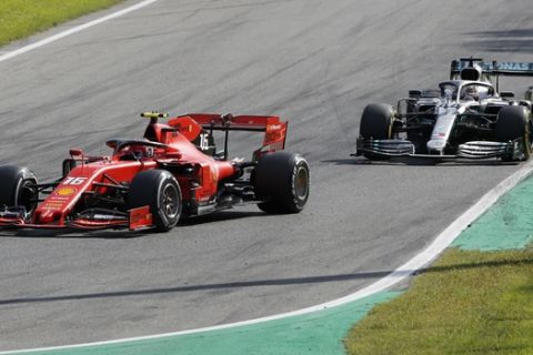 Ferrari driver Charles Leclerc of Monaco is chased by Mercedes driver Lewis Hamilton of Britain during the Formula One Italy Grand Prix at the Monza racetrack, in Monza, Italy, Sunday, Sept.8, 2019. (AP Photo/Antonio Calanni)