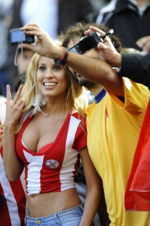 Fans of Paraguay and Brazil take pictures the start of their 2011 Copa America quarter-final football match held at the Ciudad de La Plata stadium in La Plata, 59 Km south of Buenos Aires, on July 17, 2011. AFP PHOTO / DANIEL GARCIA