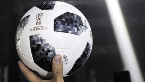 The official match ball for the 2018 soccer World Cup in Russia is displayed during the unveiling ceremony in Moscow, Russia, Thursday, Nov. 9, 2017. Lionel Messi has presented the ball for next year's World Cup in Russia. The Telstar 18 has a retro black-and-white design harking back to the original Adidas Telstar ball used for the 1970 World Cup. (AP Photo/Oleg Shalmer)