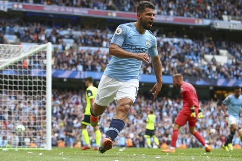 Manchester City's Sergio Aguero celebrates scoring his side's third goal of the game during the English Premier League soccer match between Manchester City and Huddersfield Town at the Etihad Stadium in Manchester, England, Sunday, Aug. 19, 2018. (AP Photo/Dave Thompson)