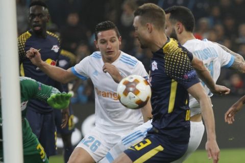 Leipzig's Stefan Islander, 2nd right, scores an own goal past his goalkeeper, Peter Gulacsi, left, during the Europa League quarter final second leg soccer match between and Olympique Marseille and RB Leipzig at the Velodrome stadium in Marseille, southern France, Thursday, April 12, 2018. (AP Photo/Claude Paris)
