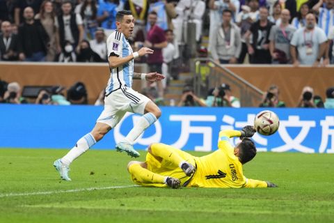 Argentina's Angel Di Maria scores his side's second goal past France's goalkeeper Hugo Lloris during the World Cup final soccer match between Argentina and France at the Lusail Stadium in Lusail, Qatar, Sunday, Dec.18, 2022. (AP Photo/Manu Fernandez)