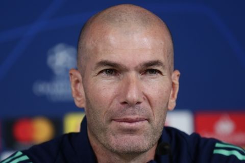 Real Madrid's head coach Zinedine Zidane attends a press conference at the team's Valdebebas training ground in Madrid, Spain, Monday, Nov. 25, 2019. Real Madrid will play against PSG in a Champions League soccer match Group A on Tuesday. (AP Photo/Manu Fernandez)