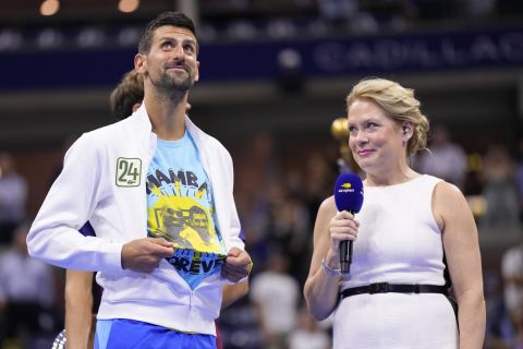 Novak Djokovic, of Serbia, reveals a t-shirt honoring the number 24 and Kobe Bryant after defeating Daniil Medvedev, of Russia, in the men's singles final of the U.S. Open tennis championships, Sunday, Sept. 10, 2023, in New York. (AP Photo/Manu Fernandez)