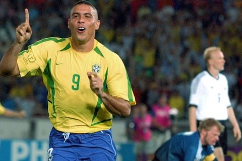 FILE - In this June 30, 2002,  file photo, Brazil's Ronaldo reacts after scoring past Germany's goalkeeper Oliver Kahn, center, and Carsten Ramelow during their 2002 World Cup final soccer match, at the Yokohama stadium in Yokohama, Japan. On this day: Brazil wins its fifth World Cup as Ronaldo strikes twice to defeat Germany 2-0. (AP Photo/Dusan Vranic, File)