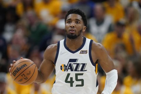 Utah Jazz guard Donovan Mitchell (45) brings the ball up court in the second half of Game 4 of an NBA basketball first-round playoff series against the Dallas Mavericks Saturday, April 23, 2022, in Salt Lake City. (AP Photo/Rick Bowmer)