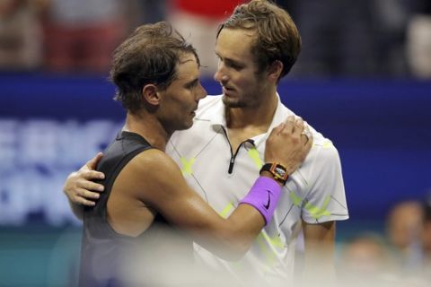 Daniil Medvedev, of Russia, congratulates Rafael Nadal, of Spain, after Nadal won the men's singles final of the U.S. Open tennis championships Sunday, Sept. 8, 2019, in New York. (AP Photo/Charles Krupa)