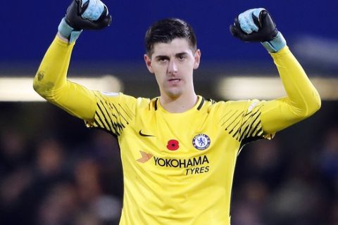 Chelsea's goalkeeper Thibaut Courtois celebrates after winning the English Premier League soccer match between Chelsea and Manchester United at Stamford Bridge stadium in London, Sunday, Nov. 5, 2017.(AP Photo/Frank Augstein)