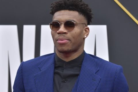 NBA player Giannis Antetokounmpo, of the Milwaukee Bucks, arrives at the NBA Awards on Monday, June 24, 2019, at the Barker Hangar in Santa Monica, Calif. (Photo by Richard Shotwell/Invision/AP)