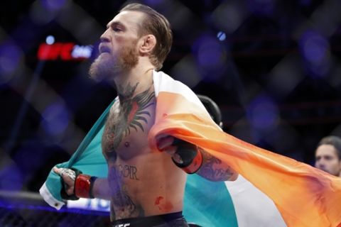 Conor McGregor celebrates after defeating Donald "Cowboy" Cerrone during a UFC 246 welterweight mixed martial arts bout, Saturday, Jan. 18, 2020, in Las Vegas. (AP Photo/John Locher)