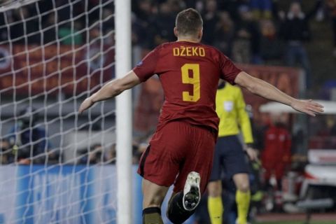 Roma's Edin Dzeko celebrates after scoring his side's opening goal after scoring his side's opening goalduring a Champions League round of 16 second-leg soccer match between Roma and Shakhtar Donetsk, at the Rome Olympic stadium, Tuesday, March 13, 2018. (AP Photo/Gregorio Borgia)
