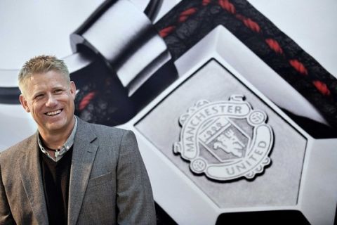 File photo of Peter Schmeichel, former Danish national soccer team and Manchester United goalkeeper, attends a Manchester United jewellery launch in Copenhagen October 21, 2009. Tottenham manager Harry Redknapp should think carefully before leaving the club to take the England job if it is offered to him, former Denmark and Manchester United goalkeeper Peter Schmeichel has told Reuters March 1, 2012. With Redknapp's Tottenham side looking like qualifying for the Champions League, his name has been strongly linked to the job of England manager. "If I was him, having done all that at Tottenham, I would ask myself - 'why would I leave this? This hasn't even peaked yet,'" Schmeichel told Reuters in Copenhagen ahead of Euro 2012.  REUTERS/Keld Navntoft/SCANPIX/Files (DENMARK - Tags: FASHION SPORT SOCCER) NO COMMERCIAL SALES THIS IMAGE HAS BEEN SUPPLIED BY A THIRD PARTY. IT IS DISTRIBUTED, EXACTLY AS RECEIVED BY REUTERS, AS A SERVICE TO CLIENTS. NO THIRD PARTY SALES. NOT FOR USE BY REUTERS THIRD PARTY DISTRIBUTORS. DENMARK OUT. NO COMMERCIAL OR EDITORIAL SALES IN DENMARK