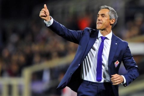 Fiorentina coach Paulo Sousa gives indications to his players during a Serie A soccer match between Fiorentina and Atalanta, at the Artemio Franchi stadium in Florence, Italy, Sunday, Oct. 4, 2015. (Maurizio Degl'Innocenti/ANSA via AP)