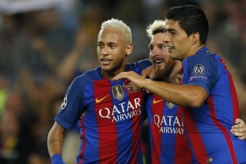 Barcelona's Lionel Messi, center, celebrates with his teammates Luis Suarez, right, and Neymar after scoring his side's fifth goal during a Champions League, Group C soccer match between Barcelona and Celtic, at the Camp Nou stadium in Barcelona, Spain, Tuesday, Sept. 13, 2016. (AP Photo/Manu Fernandez)