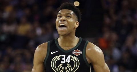Milwaukee Bucks' Giannis Antetokounmpo reacts after Golden State Warriors' Kevin Durant was ejected during the first half of an NBA basketball game Thursday, March 29, 2018, in Oakland, Calif. (AP Photo/Marcio Jose Sanchez)