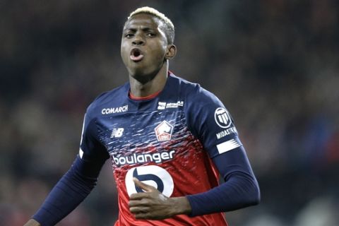 Lille's Victor Osimhen reacts after scoring during his French League One soccer match between Lille and Brest at the Lille Metropole stadium, in Villeneuve d'Ascq, northern France, Friday, Dec. 6, 2019. (AP Photo/Michel Spingler)