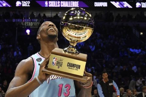 Miami Heat's Bam Adebayo holds the trophy after winning NBA basketball's All-Star Skills Challenge, Saturday, Feb. 15, 2020, in Chicago. (AP Photo/David Banks)