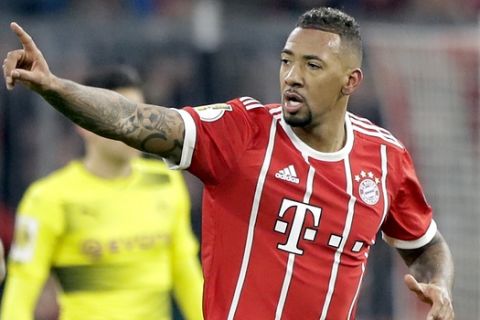 Bayern's Jerome Boateng celebrates after scoring the opening goal during the round of sixteen German soccer cup match between FC Bayern Munich and Borussia Dortmund in Munich, Germany, Wednesday, Dec. 20, 2017. (AP Photo/Matthias Schrader)
