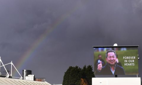 A rainbow forms over a screen showing an image of Leicester City Chairman Vichai Srivaddhanaprabha ahead of the Premier League match against Burnley at the King Power Stadium, Leicester, England, Saturday Nov. 10, 2018. (Joe Giddens/PA via AP)