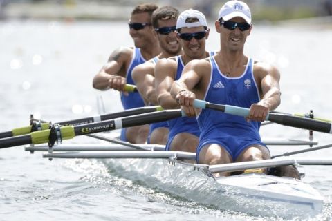 Greece's Stergios Papachristos, Ioannis Tsilis, Georgios Tziallas and Ioannis Christou compete in the men's four rowing heats during the London 2012 Olympic Games at Eton Dorney, west of London, July 30, 2012. REUTERS/DAMIEN MEYER/Pool  (BRITAIN - Tags: SPORT OLYMPICS ROWING)