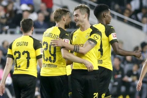 Borussia Dortmund forward Maximilian Philipp, second from right, celebrates with Marcel Schmelzer (29) during the second half of an international friendly soccer match against Los Angeles FC in Los Angeles, Tuesday, May 22, 2018. The game ended in a 1-1 draw. (AP Photo/Ringo H.W. Chiu)