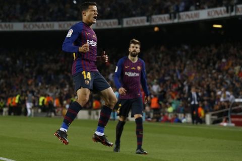 FC Barcelona's Coutinho celebrates after scoring during the Spanish La Liga soccer match between FC Barcelona and Real Sociedad at the Camp Nou stadium in Barcelona, Spain, Sunday, May 20, 2018. (AP Photo/Manu Fernandez)
