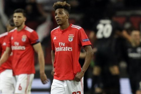 Benfica's Gedson Fernandes, center, racts in dejection after Frankfurt's Sebastian Rode scoried his side's second goal during the Europa League quarterfinals, second leg soccer match between Eintracht Frankfurt and Benfica at the Commerzbank Arena in Frankfurt, Germany, Thursday, April 18, 2019. (AP Photo/Michael Probst)